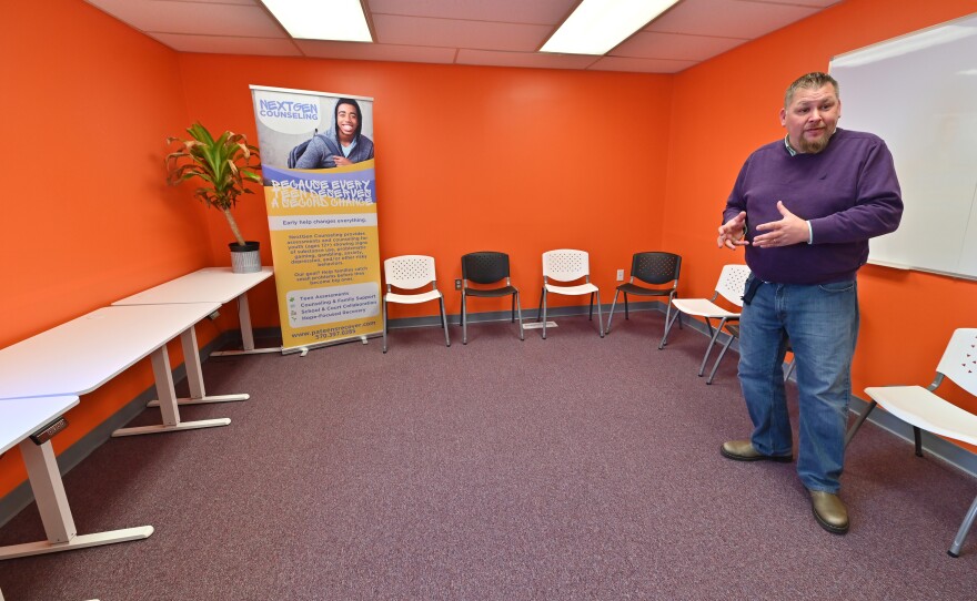 Project Director John Wasp stands in the group therapy room at the teen counseling center NextGen in Dickson City.