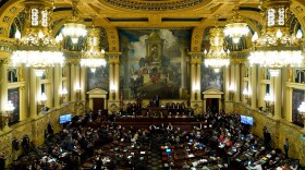 FILE - Democratic Gov. Tom Wolf delivers his budget address for the 2022-23 fiscal year to a joint session of the Pennsylvania House and Senate in Harrisburg, Pa., Tuesday, Feb. 8, 2022. More than one-quarter of state lawmakers whose seats are up for election across the U.S. are guaranteed to be gone from office next year — a statistic almost certain to grow when the votes are counted from the November general election.