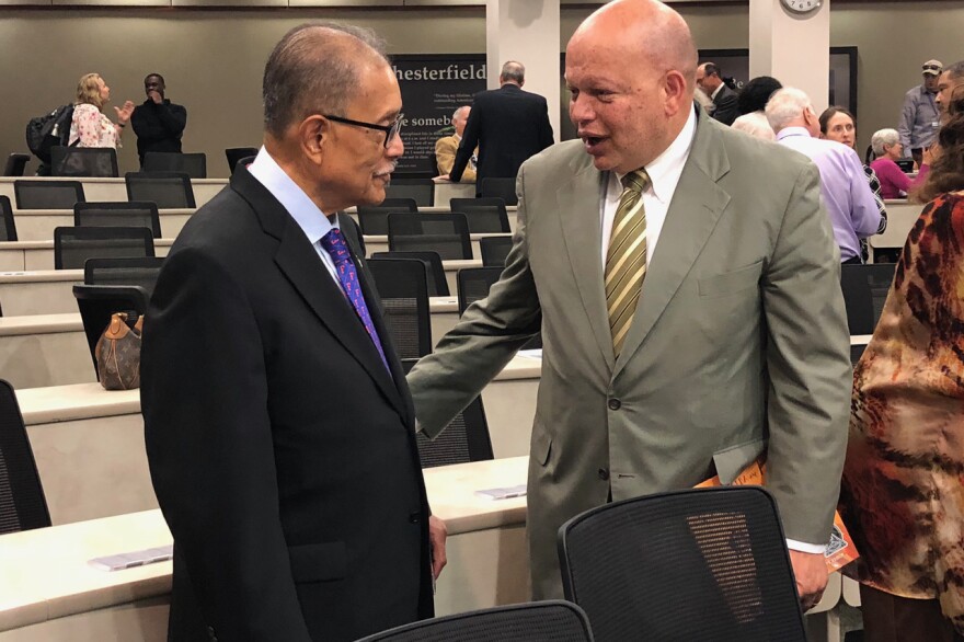 George Starke, UF's first black student, and Theodore Shaw, a law professor at the University of North Carolina and former president of the NAACP Legal Defense and Education Fund, share a moment after the commemoration this week. (Giovanna Kubota/WUFT News)