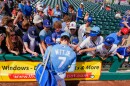Bobby Witt Jr. signs autographs before a spring training baseball game against the Chicago Cubs, Monday, Feb. 23, 2026, in Surprise, Ariz.