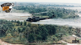 U.S. Army Huey helicopter sprays highly toxic defoliant called 'Agent Orange' over waterways and farm fields during the Vietnam War.