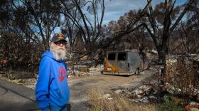 Joseph Powell stands among his neighbors’ destroyed homes at Talent Mobile Estates in Talent, Ore. on October 13, 2020. Powell’s home was one of only a few that the Almeda Fire left standing.