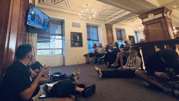 Watchers gather in the overflow area outside council chambers as speakers line up to discuss data centers.