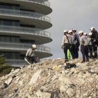 Rescue workers on the rubble pile at the Champlain Tower South in Surfside on July 6.