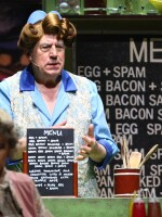 Terry Jones performs the famous "Spam" sketch during 2014's <em>Monty Python Live (Mostly)</em> stage show. Jones died at the age of 77 after suffering from dementia.
