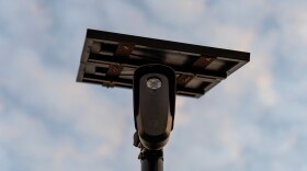 A Flock Safety license plate reader is seen along a public road, Oct. 16, 2025, in Houston. The cameras have drawn criticism from North Texas residents, with some calling for their removal.
