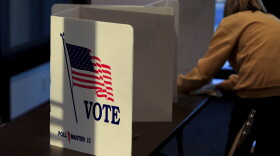 A poll worker cleans a voting station after a voter left the Fairfield Greens South Trace Golf Course on Election Day, Tuesday, Nov. 3, 2020, in Cincinnati. 