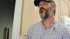 Alex Drueke, ecently released from three months of Russian captivity, pauses during an interview at home in Tuscaloosa, Ala., on Friday, Sept. 30, 2022. Drueke and fellow Alabamian Andy Huynh were captured after traveling to Ukraine to help in the fight against Russian invaders. (AP Photo/Jay Reeves)
