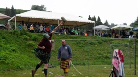 Jason Simmons throws a stone during the Katchemak Bay Highland Games.