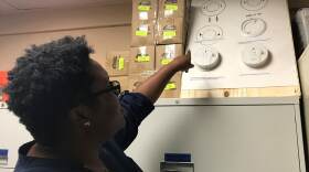 Gainesville Red Cross disaster program manager Bianca Esprit points to smoke detectors that the organization installs inside local homes. (John Lievonen/WUFT News)