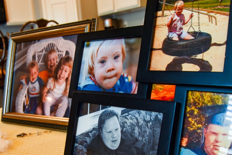 Photos of Ethan Saylor are displayed on his mother's kitchen table.