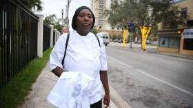 Michelle Phillips walks through her Overtown neighborhood on her way to one of her final days of classes at the Hospitality Education Advancement Training center at the Overtown Performing Arts Center kitchen. 