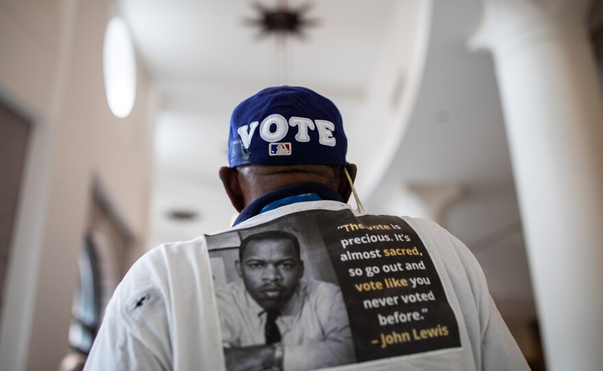 Edward Jones wears a baseball hat with the word Vote on it in the Texas State Capitol while he and others wait to testify before House and Senate committees, which began hearings on election integrity bills, on July 10, 2021 in Austin. Texas Republicans are moving forward with their effort to overhaul the state's voting laws during the 87th Legislatures' special session.