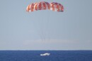 NASA’s Orion spacecraft with Artemis II crewmembers NASA astronauts Reid Wiseman, commander; Victor Glover, pilot; Christina Koch, mission specialist; and CSA (Canadian Space Agency) astronaut Jeremy Hansen, mission specialist aboard is seen as it lands in the Pacific Ocean off the coast of California, Friday, April 10, 2026. NASA’s Artemis II mission took Wiseman, Glover, Koch, and Hansen on a 10-day journey around the Moon and back to Earth. Following a splashdown at , NASA, U.S. Navy, and U.S. Air Force teams are working to bring the crewmembers and Orion spacecraft aboard USS John P. Murtha.