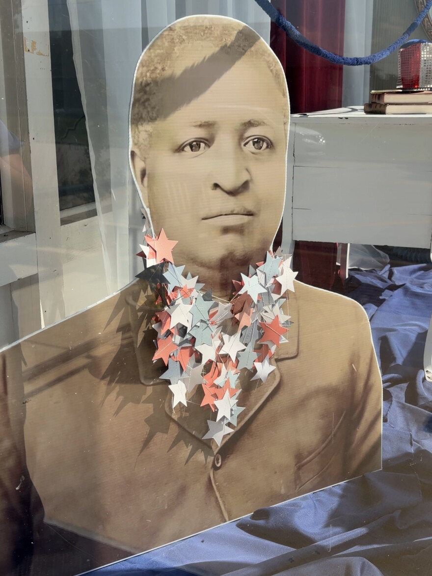 a cardboard cutout of a sepia-tone picture of David Strother