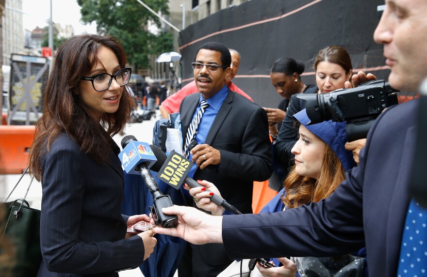 Attorney Carrie Goldberg speaks to the press as Weinstein leaves court after a criminal case hearing on Oct. 11 in New York City.