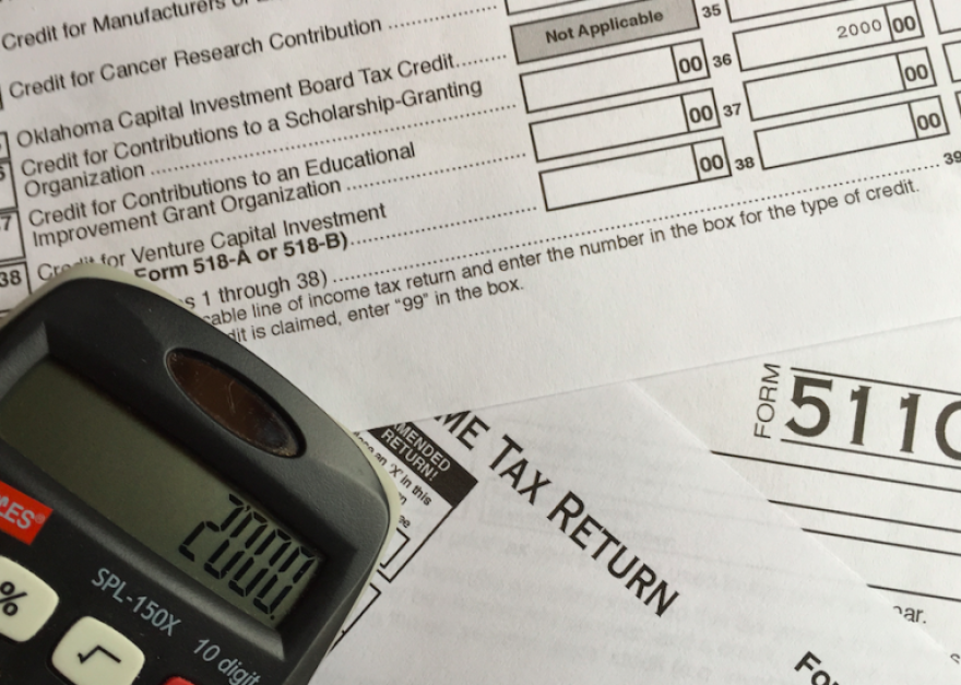 tax forms and a calculator