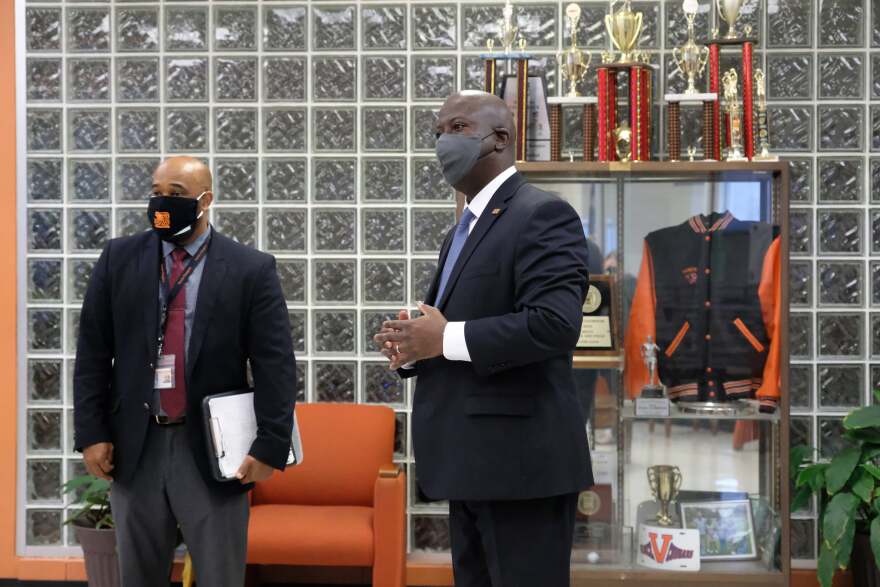 Superintendent Earnest Winston (right) visits Julius Chambers High School as in-person classes resume this week.