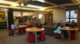Elementary students practice reading with Amira Learning in the library at Tenderloin Community Elementary School. 
