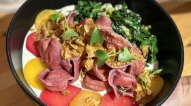 A colorful dish topped with greens  served at Side Yard Farm & Kitchen in Phoenix, Oregon.