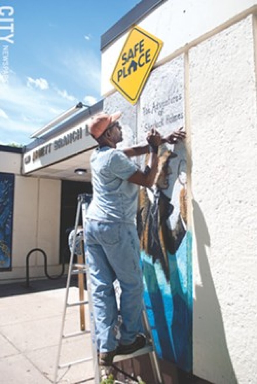 Richmond Futch Jr. recently created a set of literary murals on the façade of the Arnett Branch Library.