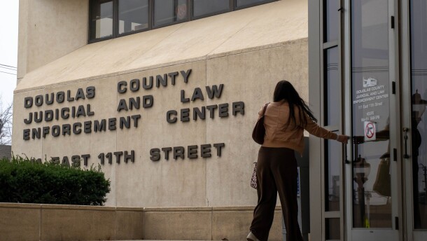 Hearings began in Lawrence on Wednesday to decide whether a judge will temporarily reverse the ban on gender affirming care for minors.