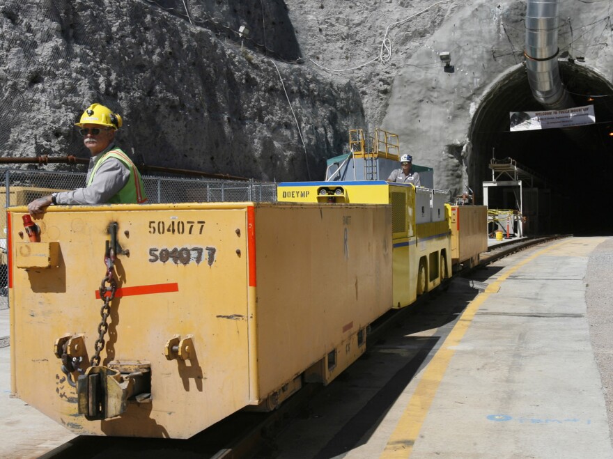 Pete Vavricka conducts an underground train from the entrance of Yucca Mountain in Nevada in 2006. President Obama canceled the planned nuclear waste repository there in 2009.