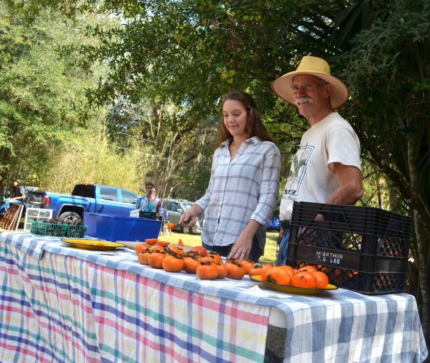 Gary and Lili Schultz came to the Fall Festival to sell kaki fuyu and chestnuts. (Nicole Dan/WUFT News)