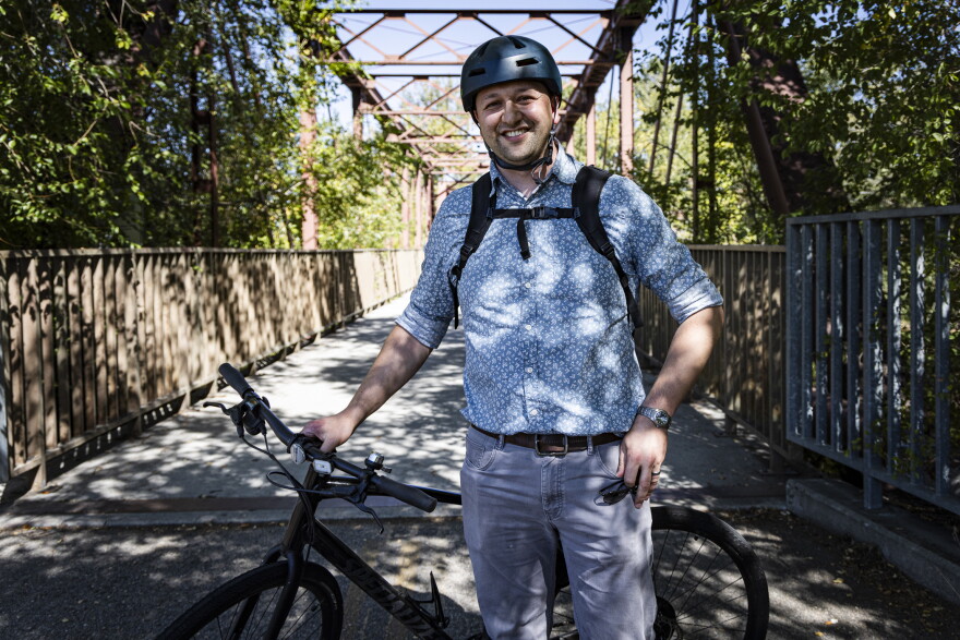 Bike commuter Bryan Bennion on his way to work on the Boise River Greenbelt. He says he's saved a lot of money in recent years by biking instead of driving.