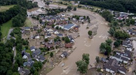 July 15, 2021: The Ahr river floats past destroyed houses in Insul, Germany.  Due to heavy rain falls, the Ahr river dramatically went over the banks the evening before. The mayors of three German towns badly hit by July's deadly floods are appealing for more help from the state and federal governments, saying the disaster caused billions of euros worth of damage. (Michael Probst/AP/File)
