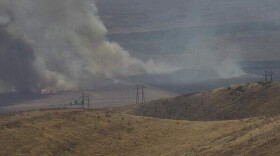 A wildfire burned more than 500 acres of land and forced some evaucations in eastern San Luis Obispo County Tuesday.