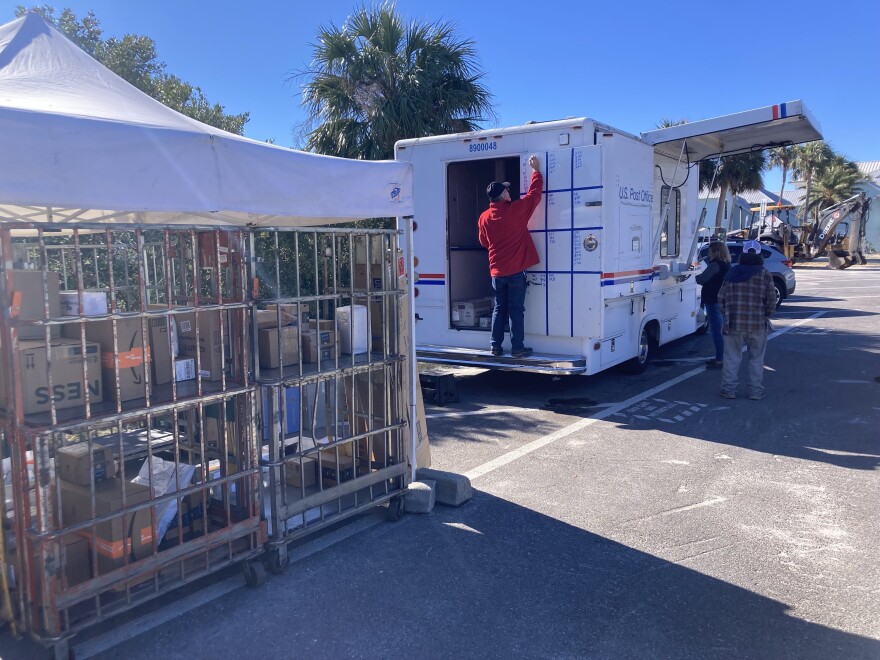 A cage holding mail and a temporary post office
