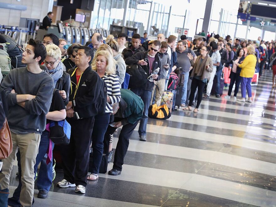 Passengers at O'Hare International Airport in Chicago wait to be screened at a Transportation Security Administration checkpoint on May 16.