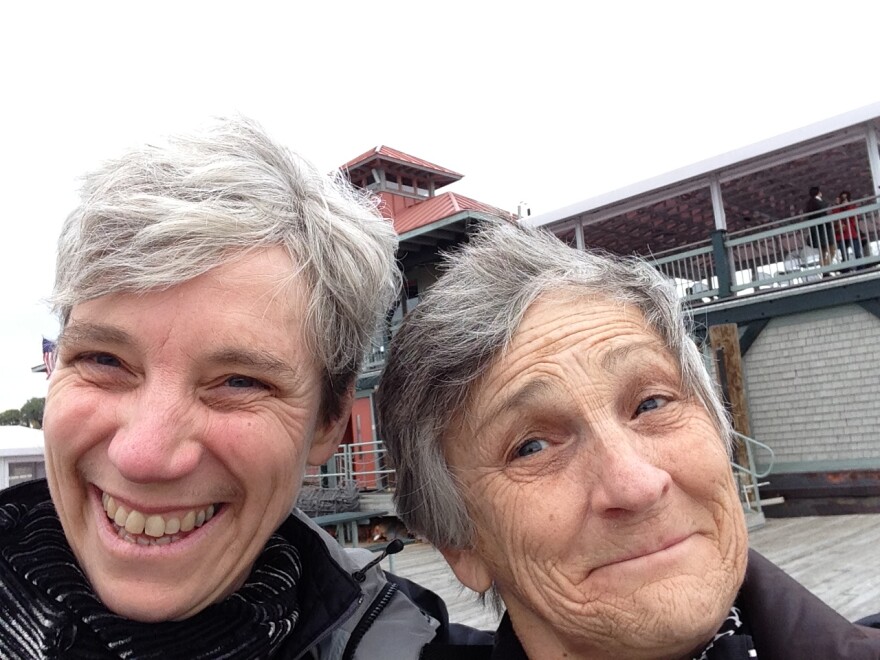 Two women smile for a selfie