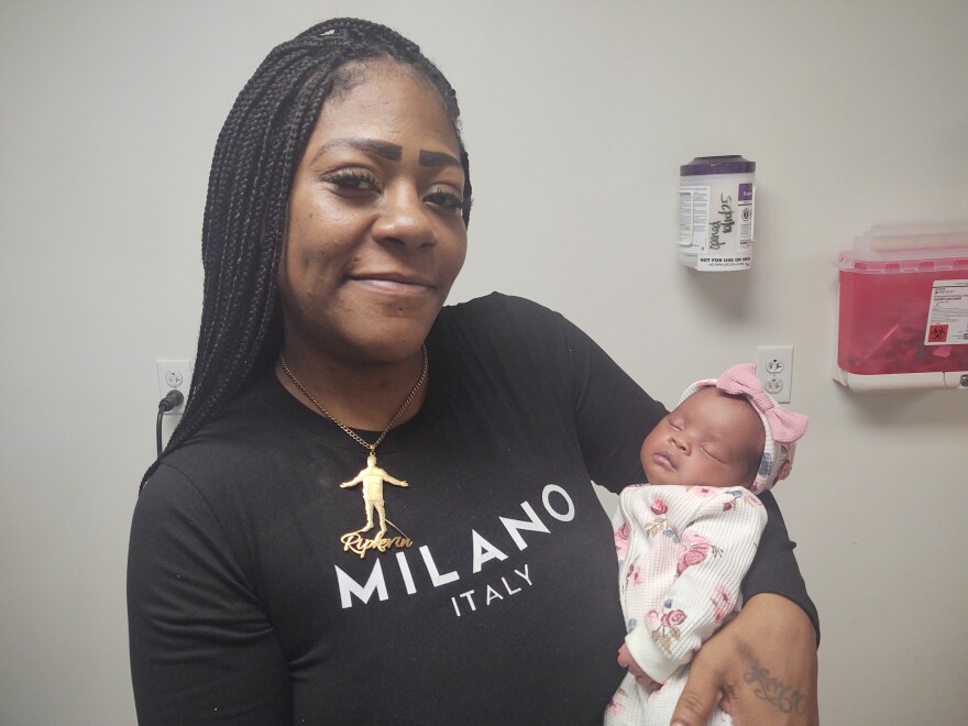 Latasha McCullers shows off her newborn daughter, Nova. They received specialized care through the Maternity Care Program, which is adding a telehealth component and expanding to serve all four counties in Northwest Florida.
