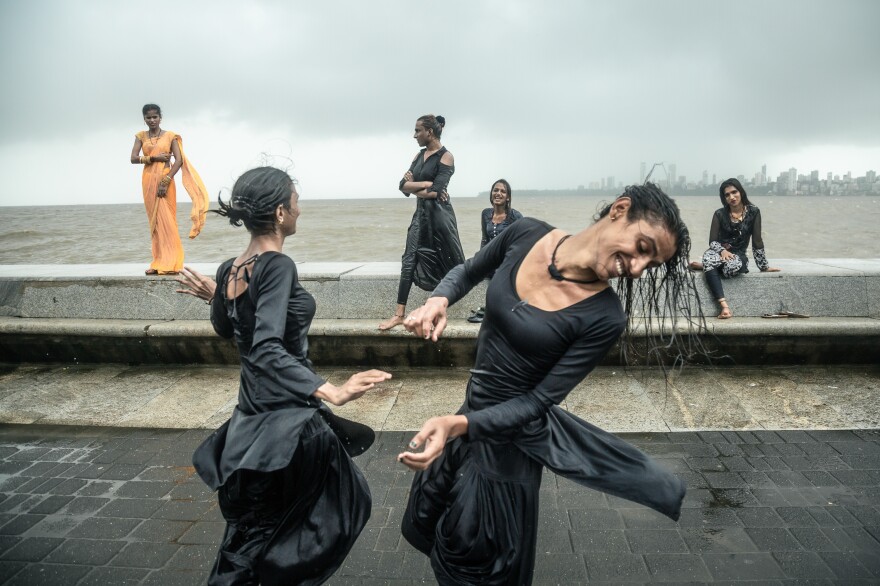 Izna and Saba, members of Mumbai's disenfranchised and discriminated against, Transgender or Hijra community, dance with each other in a state of pure happiness to the background of their friends' laughter and smiling faces. The reason for their happiness is gratitude and sere joy for the high tide and the rains that baptise the city of Mumbai during its monsoon season.