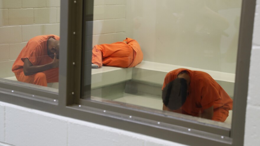 Immigrants await processing at an Immigration and Customs Enforcement (ICE) detention center in Adelanto, California. By filing a lawsuit under the Freedom of Information Act, NPR obtained a trove of inspection reports detailing serious problems at this ICE facility and others across the United States.