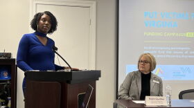 Samaritan House executive director Robin Gaulthier looks on as Sanu Dieng speaks about her organization, Transition Family Violence Services. The groups say they will run out of funding without help from state lawmakers. (Photo: Laura Philion)