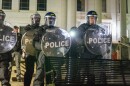 Utah Highway Patrol officers line up outside the John R. Park building at the University of Utah in full riot gear. They were present to disperse an encampment set up by pro-Palestine protesters on April 29, 2024