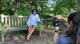 UNC-Chapel Hill graduating senior Amy Martin wears a homemade Carolina facemask during her graduation photoshoot in Coker Arboretum last week.