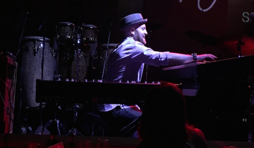 Lao Tizer playing a keyboard