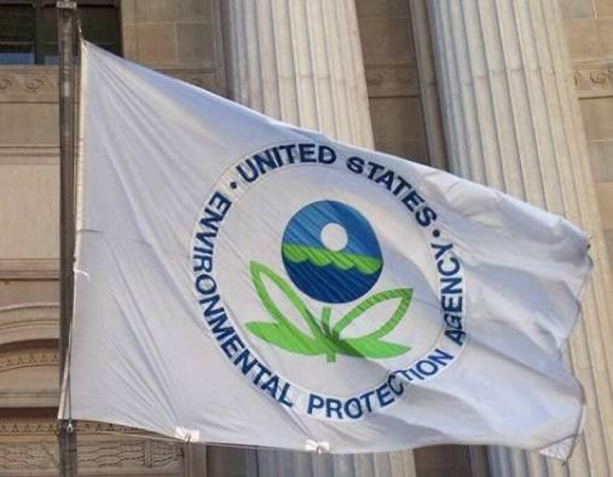A picture of a white flag blowing in the wind that reads, "United States Environmental Protection Agency".
