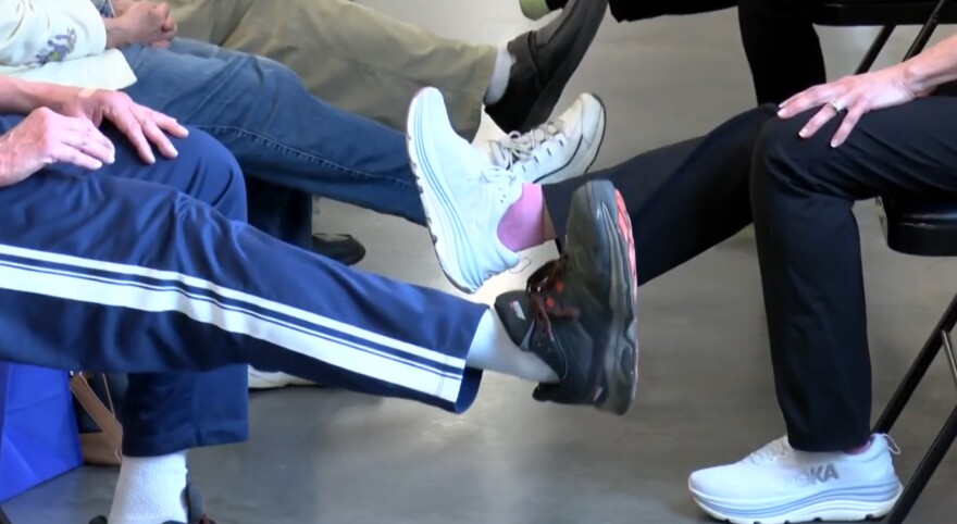 Seniors work on exercises designed reduce the risk of falls at an event in Merrill