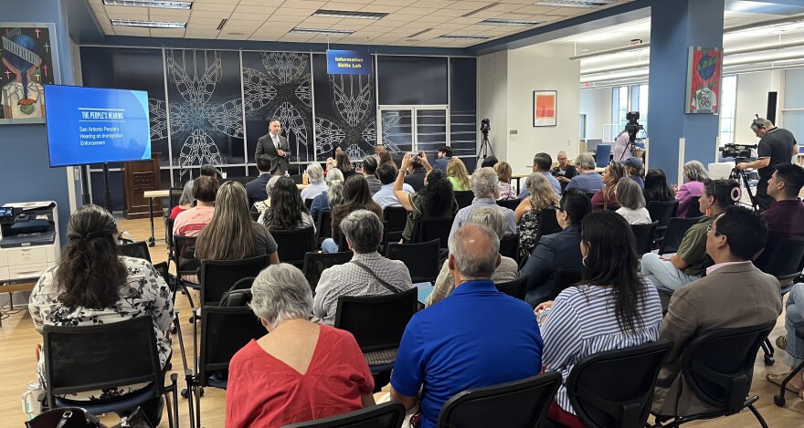 Dr. Abel Antonio Chávez, President of Our Lady of the Lake University, welcomes the group of residents, activists, and civil rights group members to the People's Hearing on Immigration Enforcement at the college's Sueltenfuss Library. 8/4/2026.