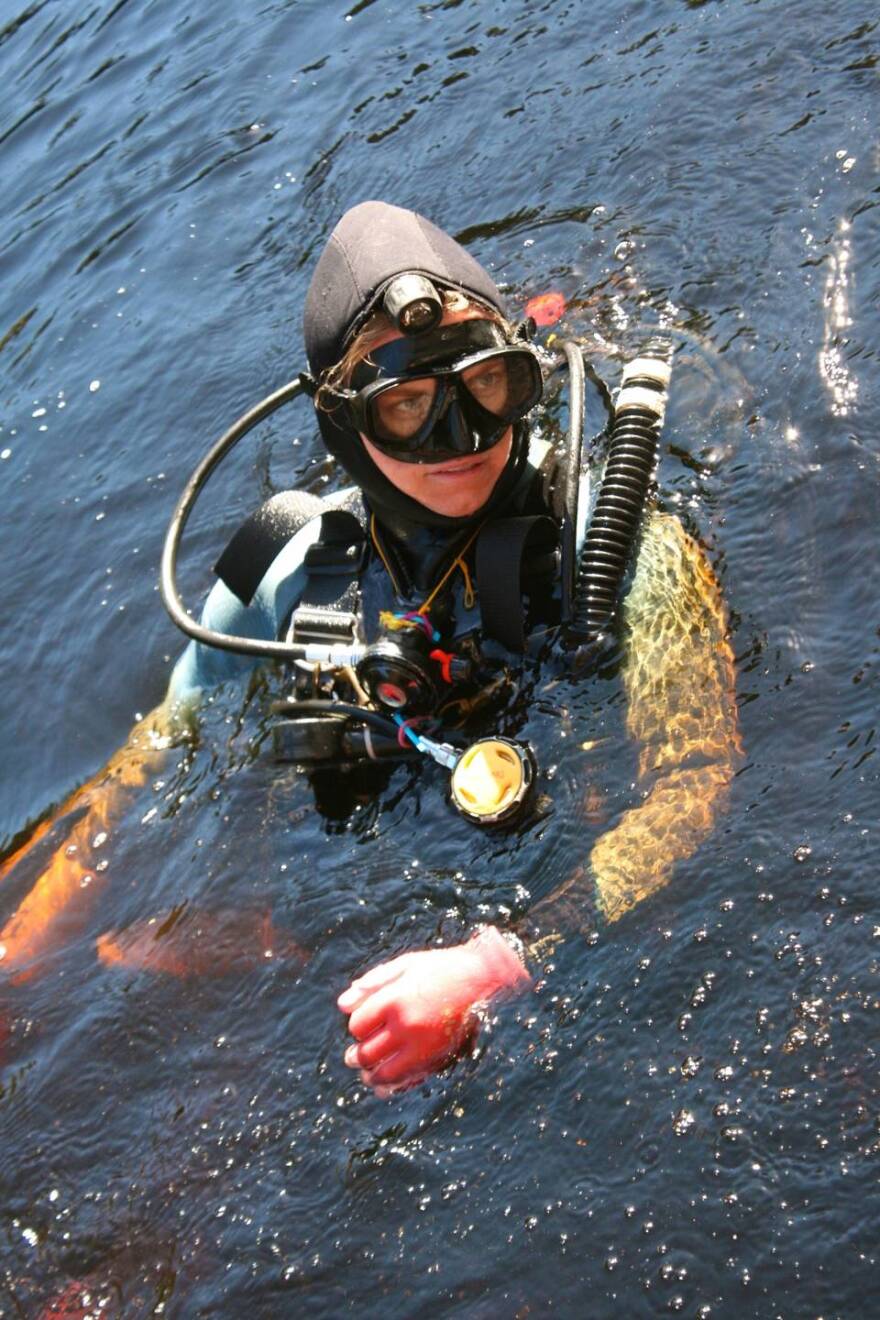 Jessi Halligan, an associate professor of anthropology at Florida State University, prepares to dive in the Aucilla River in search of artifacts from the first people who occupied Florida. <br/>