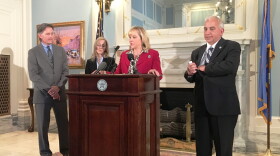Gov. Mary Fallin announces new cabinet appointments with Mike Hunter, Jennifer Chance, and Chris Benge during a news conference Monday.