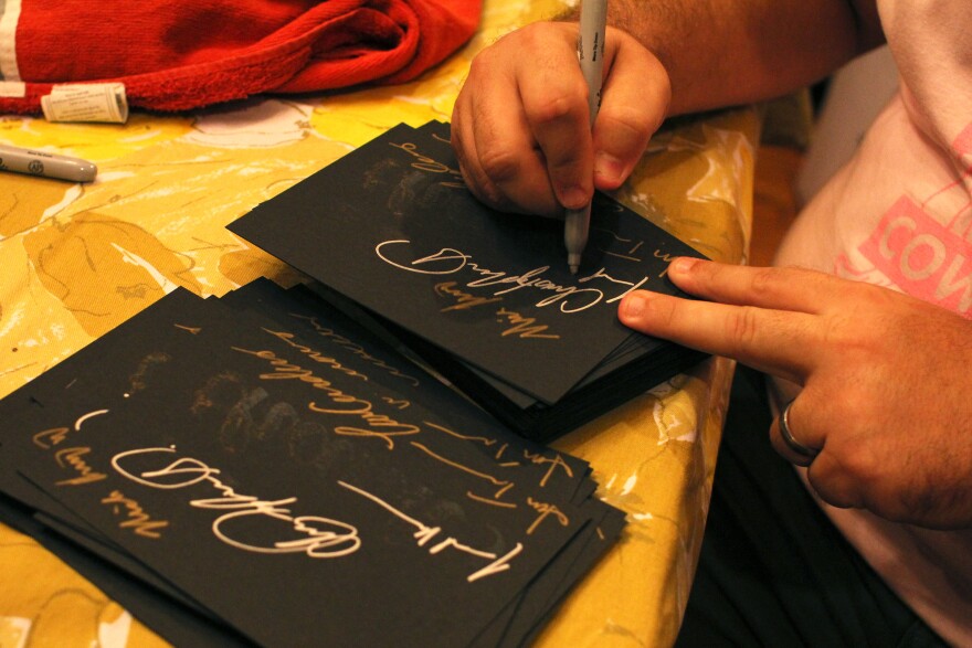 Organizers (Jared Rourke pictured) personally signed thank you cards for inclusion in attendee's tote bags