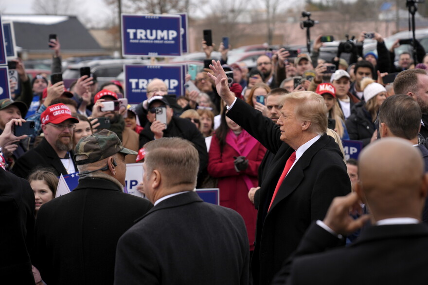Trump waves to supporters at a campaign stop in Londonderry, N.H., on Tuesday.