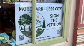 Properties around Park City have displayed "more park, less city" signs, like this one on Main Street Aug. 11, 2026.