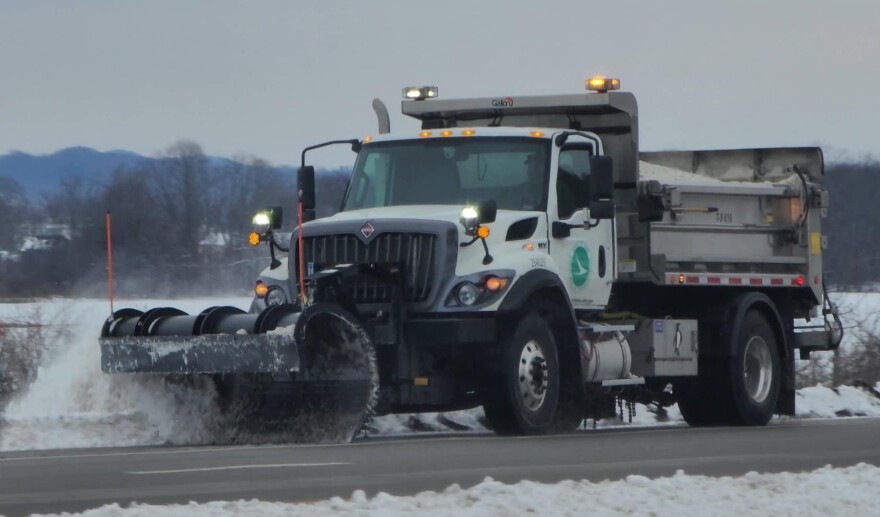 a snow plow plowing snow
